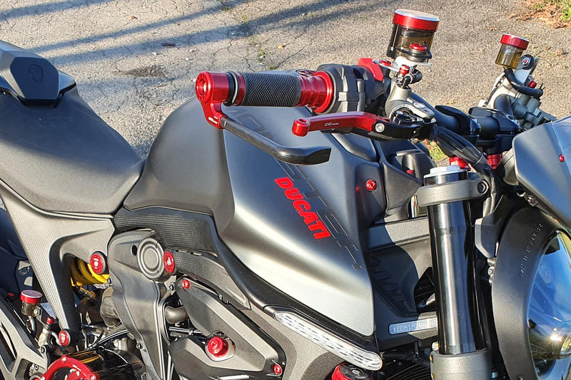 Adapter to install brake and clutch lever protection.